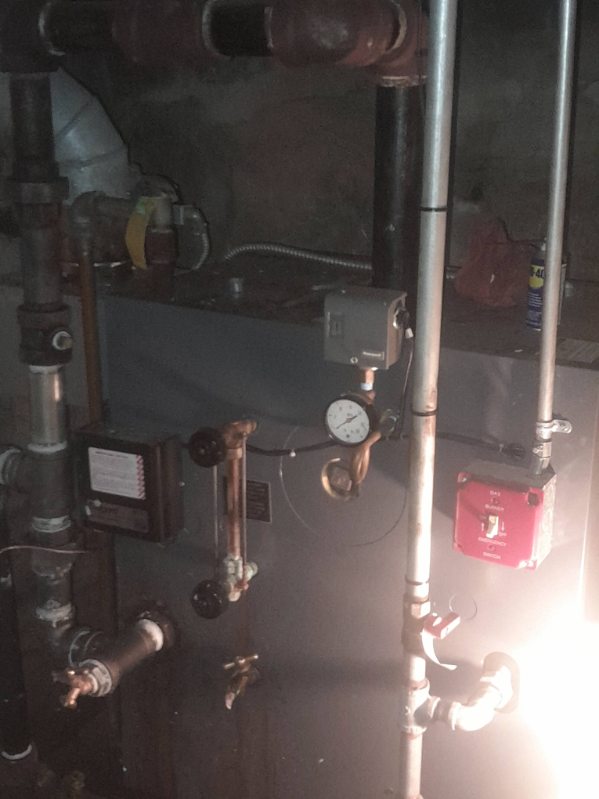 Residential boiler system with piping, pressure gauges and control valves