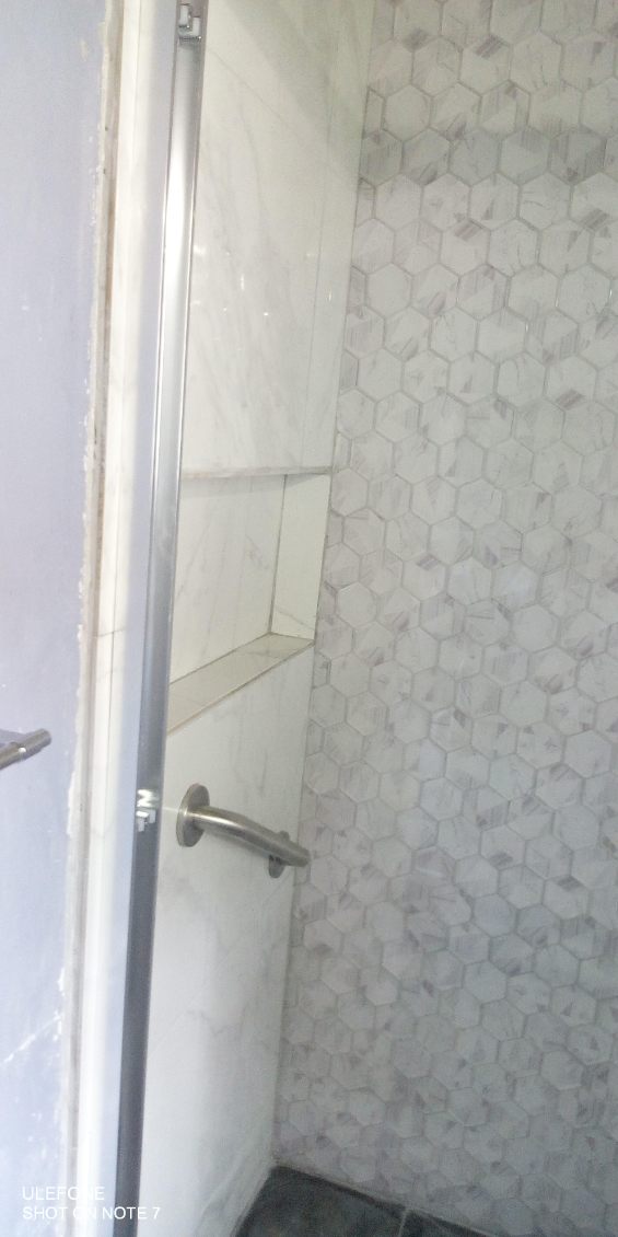 Hexagonal mosaic tiled shower